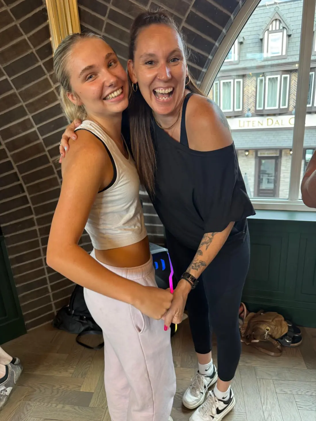 Two dancers laughing cheek to cheek after the lesson at The Grand Hall
