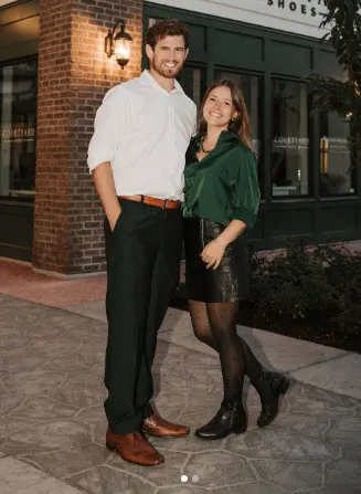 Jade and Cory Lehti, owners of The Grand Hall, standing together outside in District 1881, Chilliwack